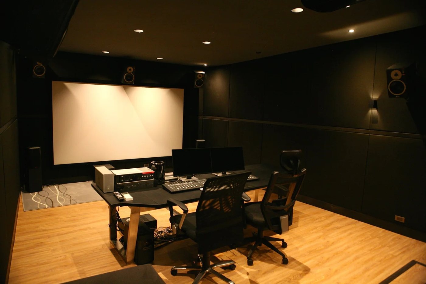 The screening and mixing room, with projection screen and monitors